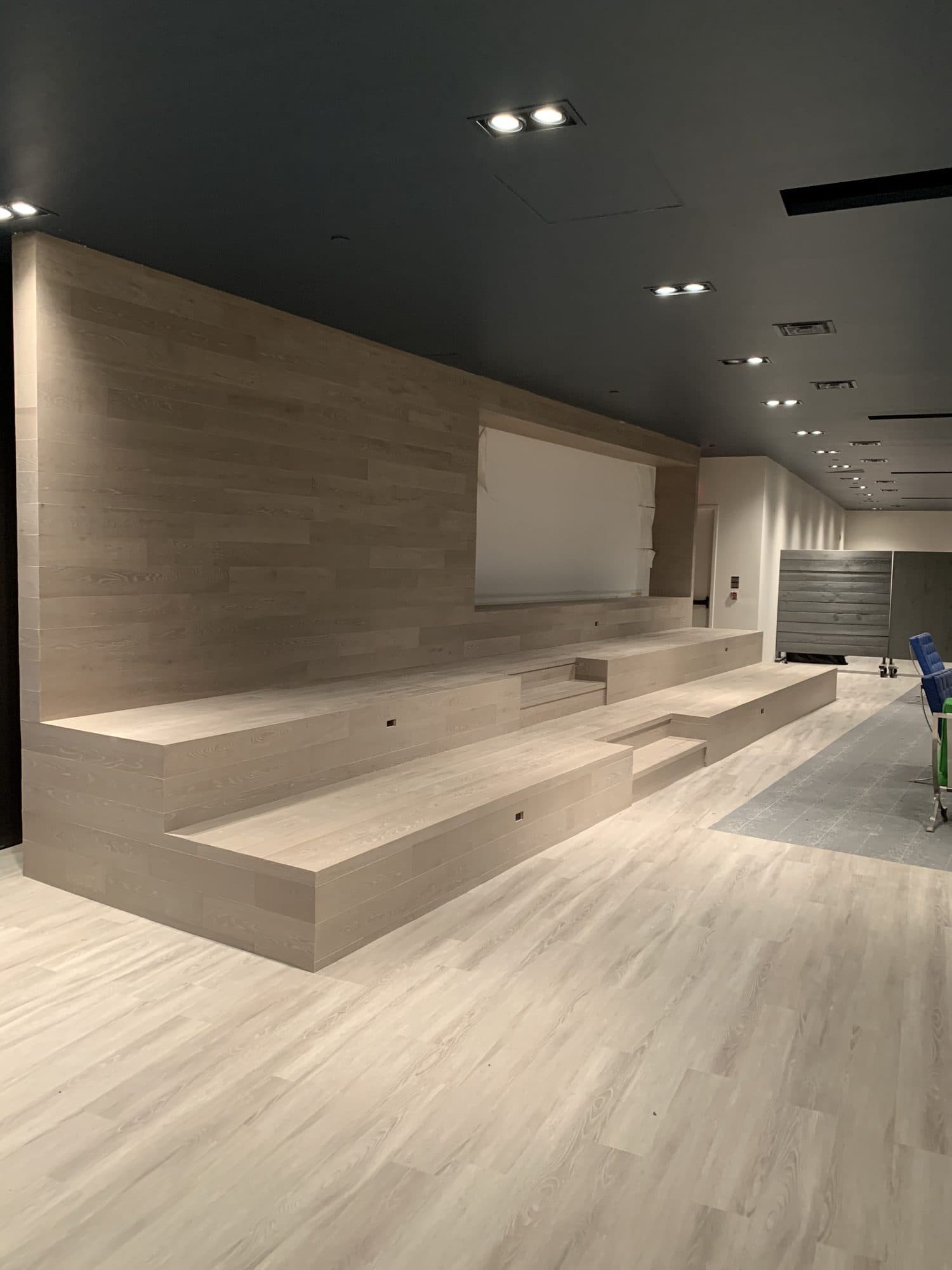 The same seating platform reclad in warm timber