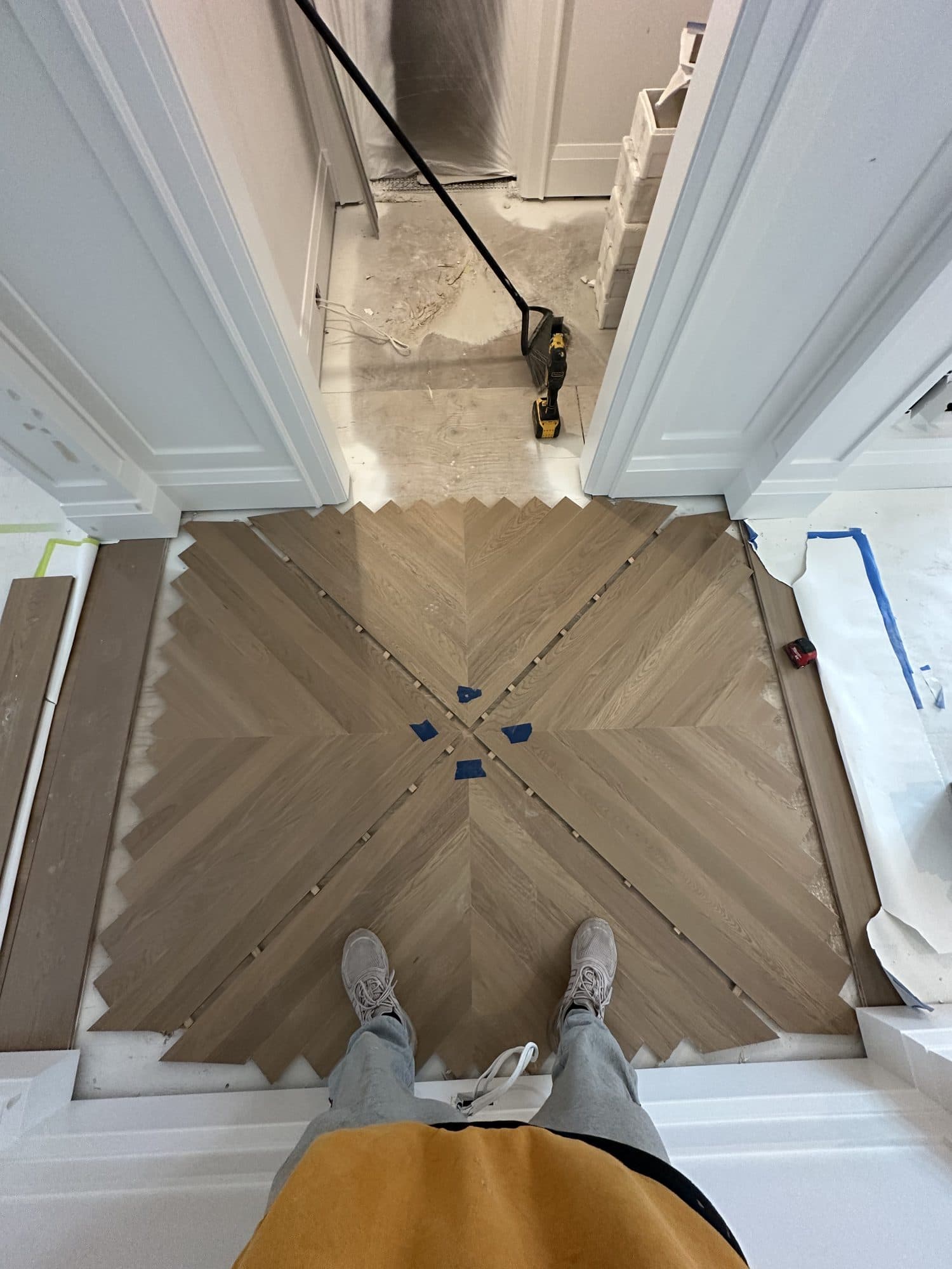 A Versailles parquet panel being laid, taped and unfinished