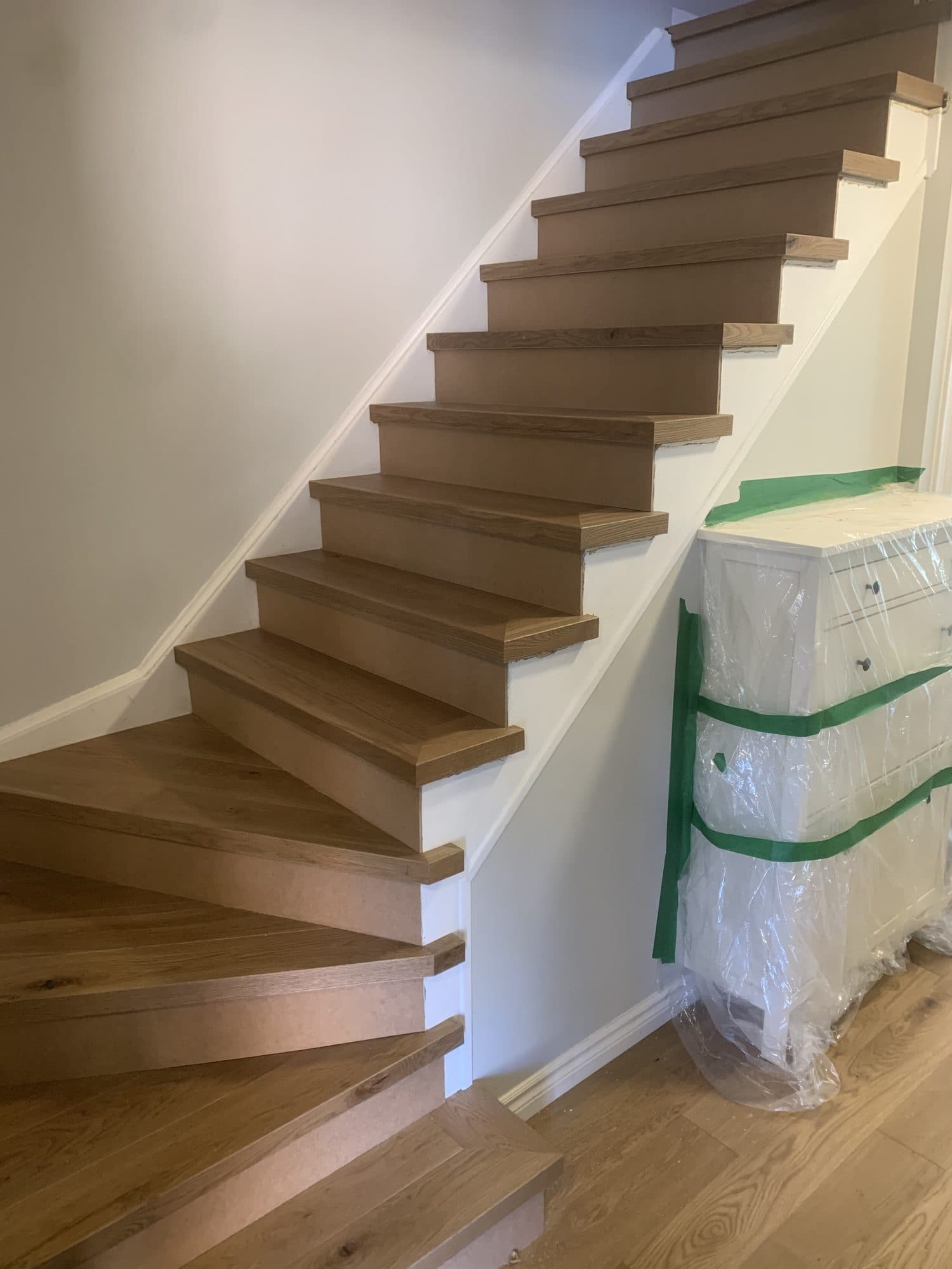 The same staircase rebuilt with solid oak treads and risers