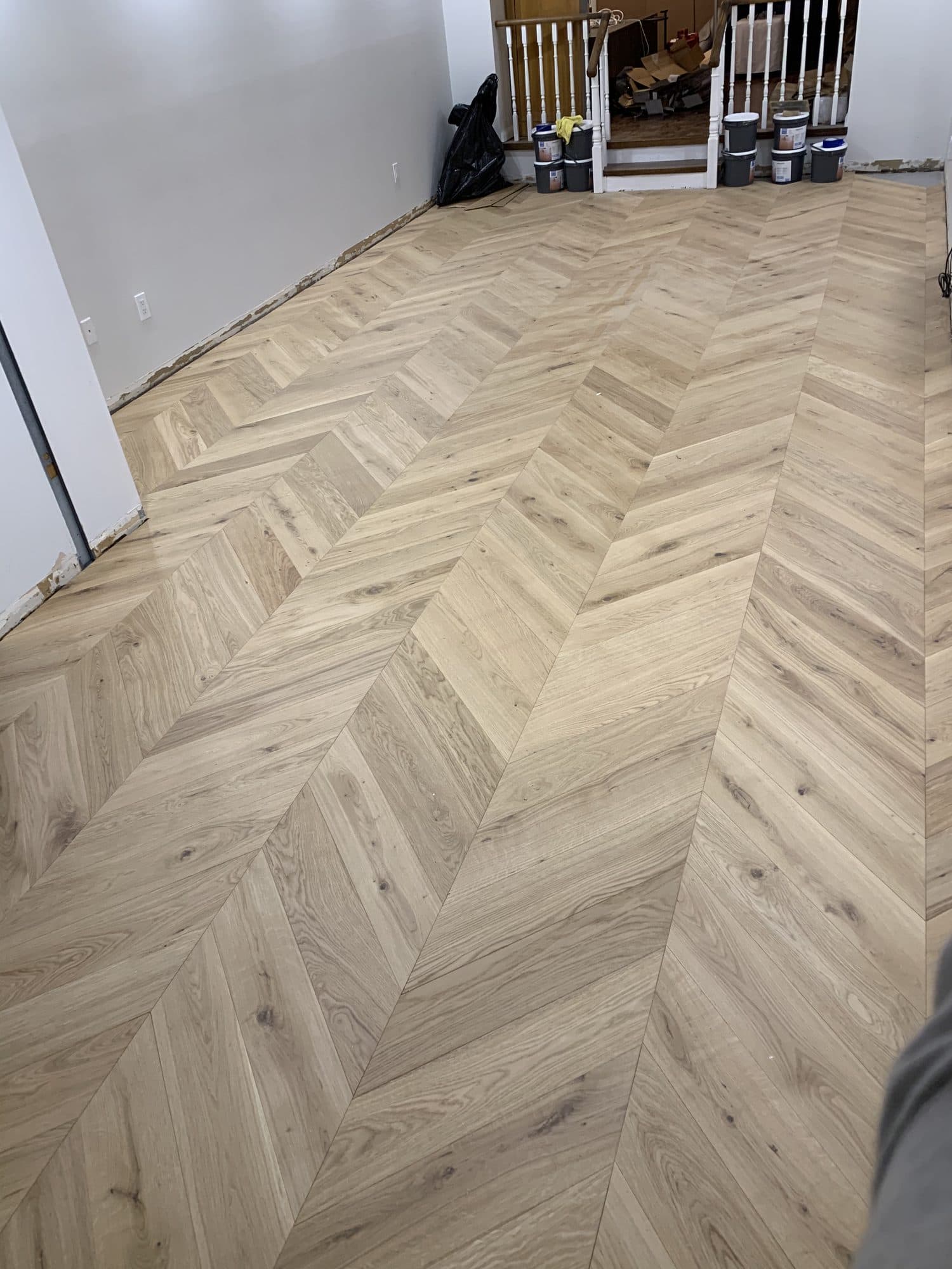Chevron hardwood flooring installed by Woodstellar