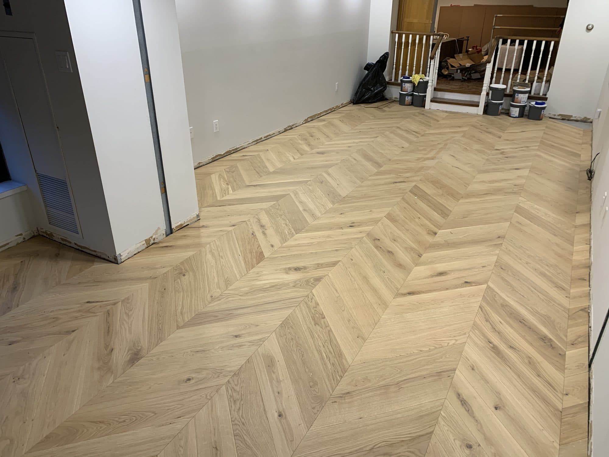 Chevron hardwood flooring installed by Woodstellar