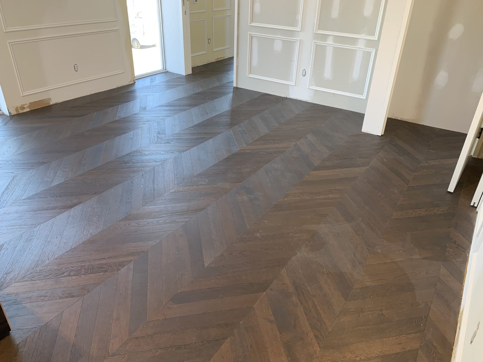 Chevron hardwood flooring installed by Woodstellar