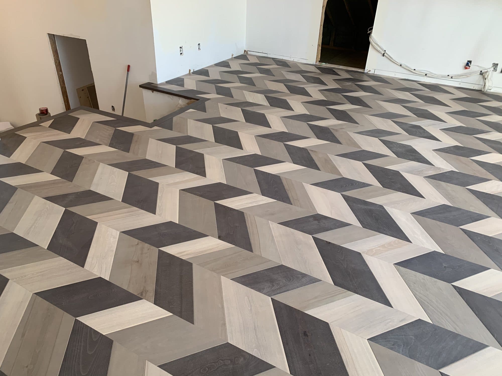 Chevron hardwood flooring installed by Woodstellar