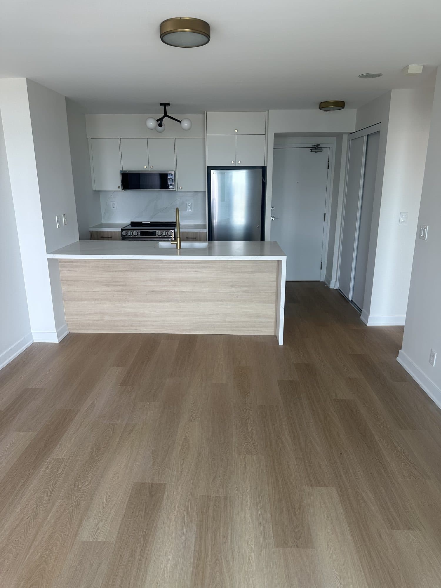 A condo renovation by Woodstellar — kitchen, bathroom and flooring