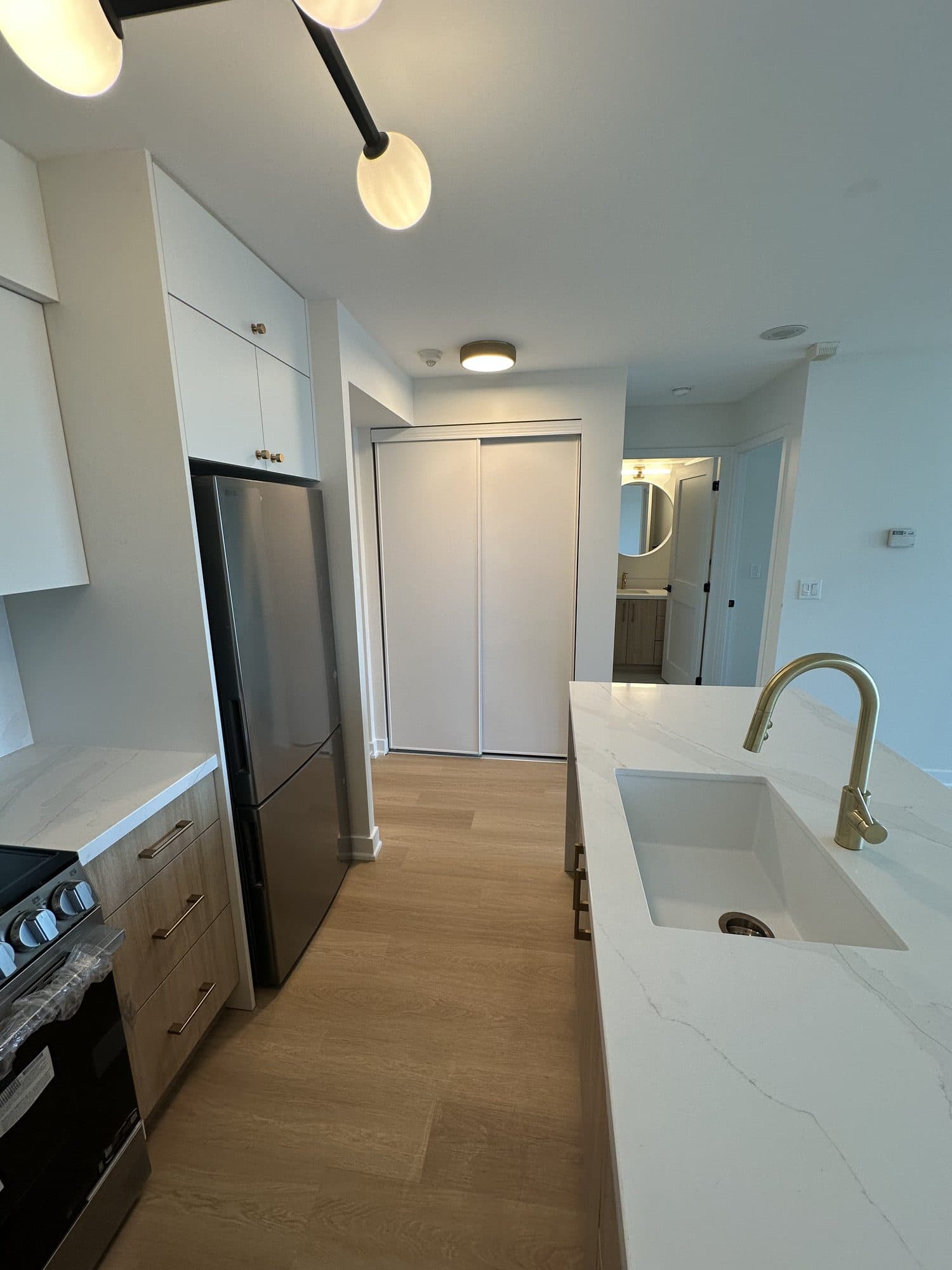 A condo renovation by Woodstellar — kitchen, bathroom and flooring