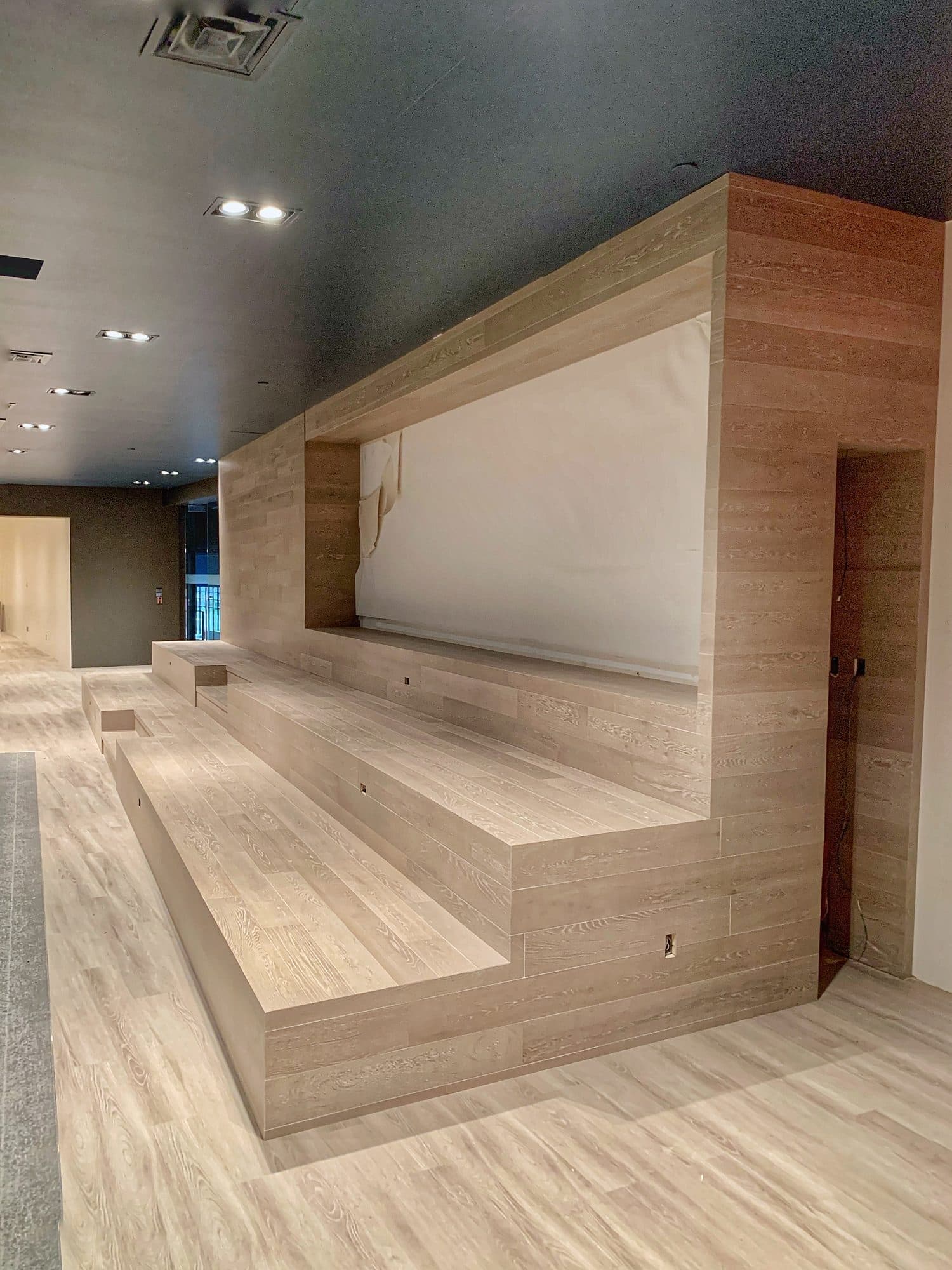 Wood stage, tiered seating and timber feature wall at the Toronto Congress Centre by Woodstellar