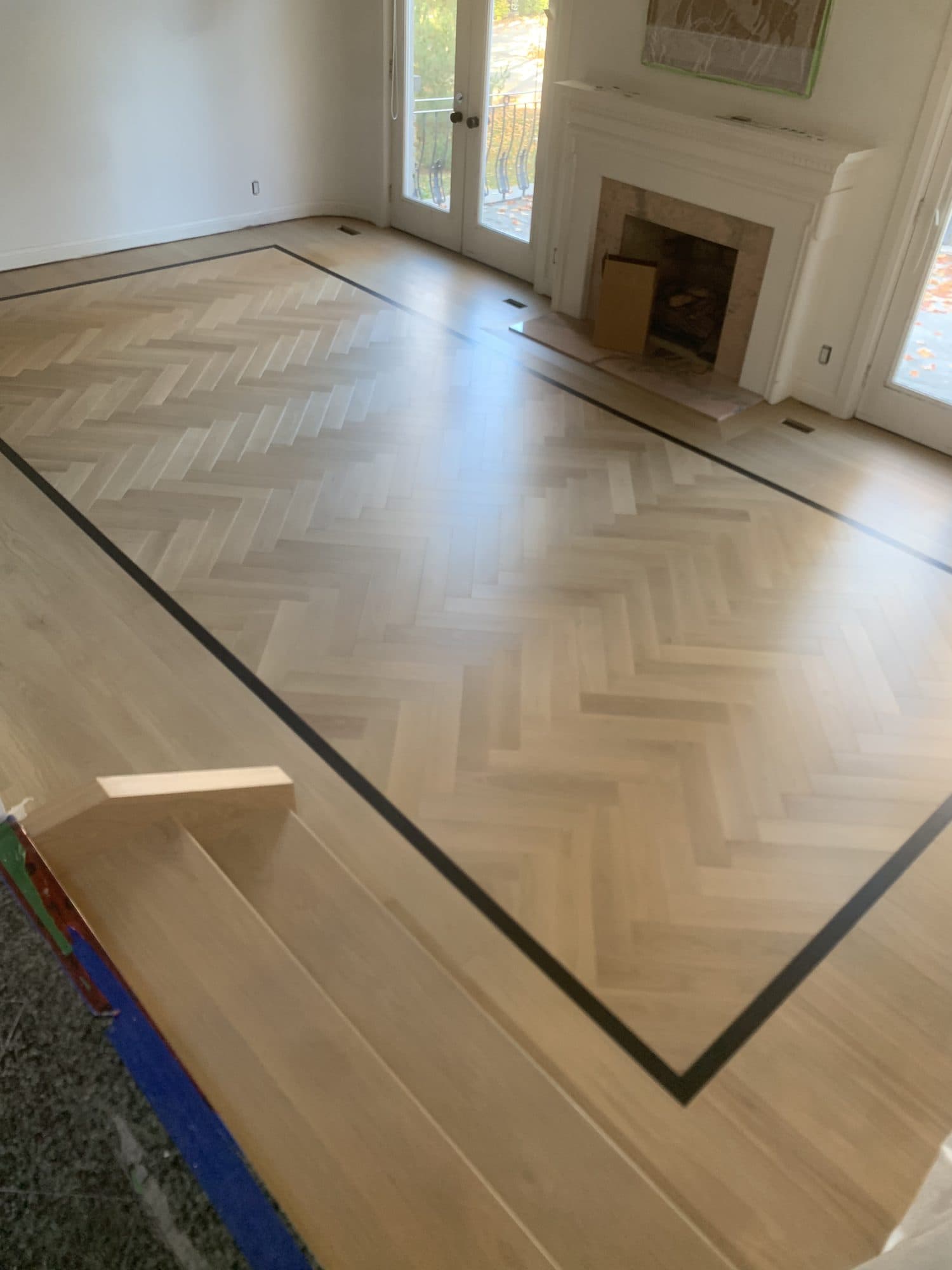 Herringbone hardwood flooring installed by Woodstellar