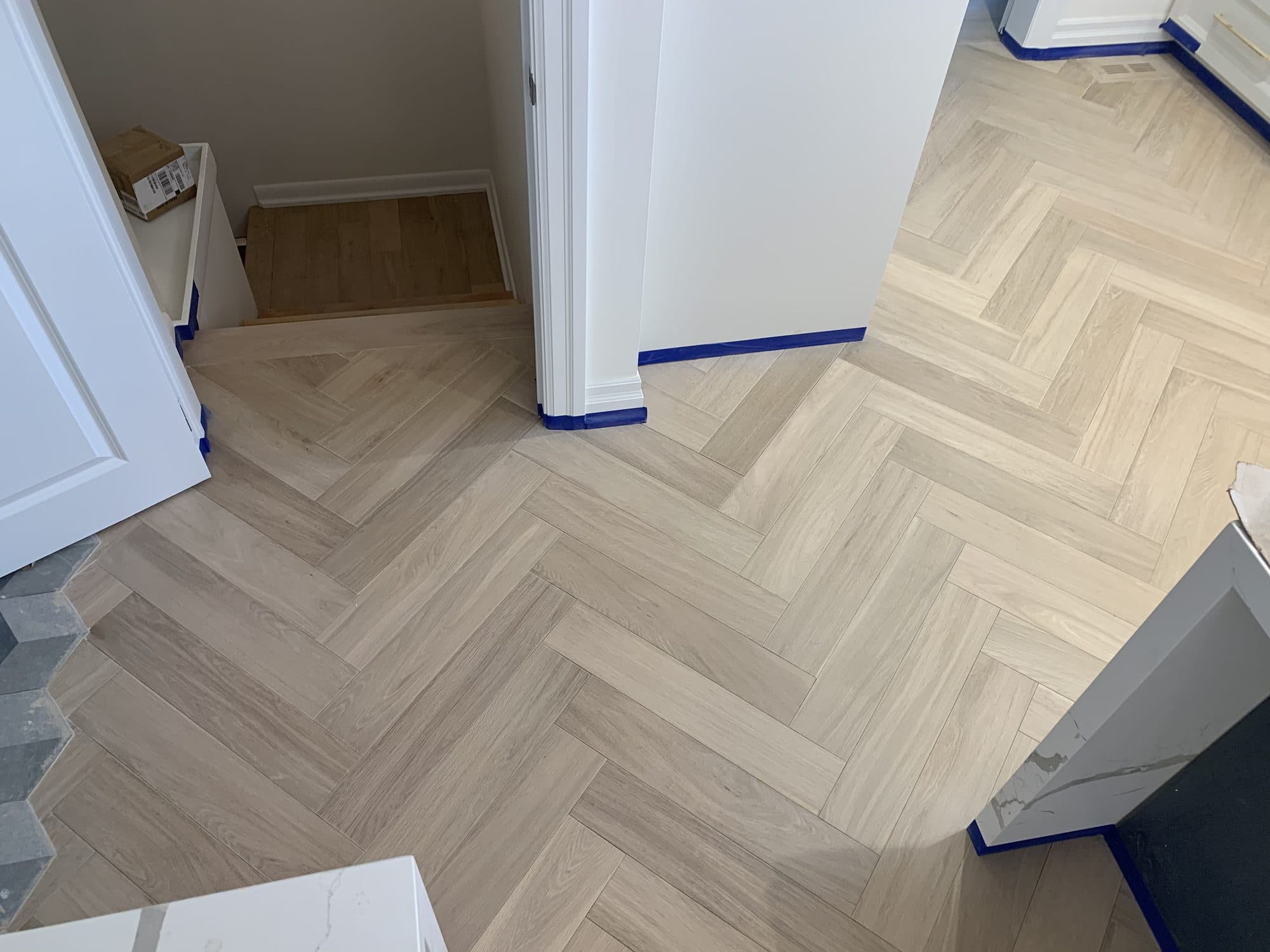 Herringbone hardwood flooring installed by Woodstellar