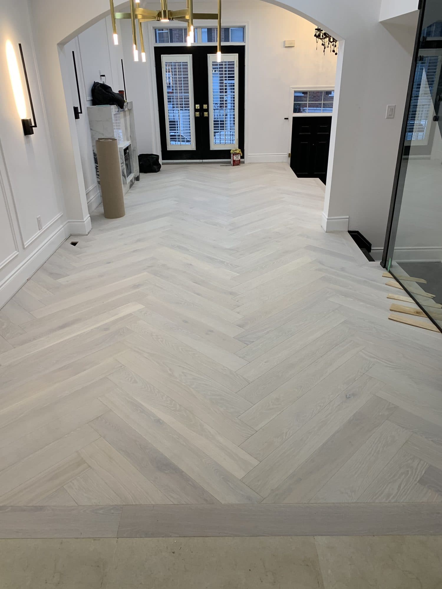 Herringbone hardwood flooring installed by Woodstellar