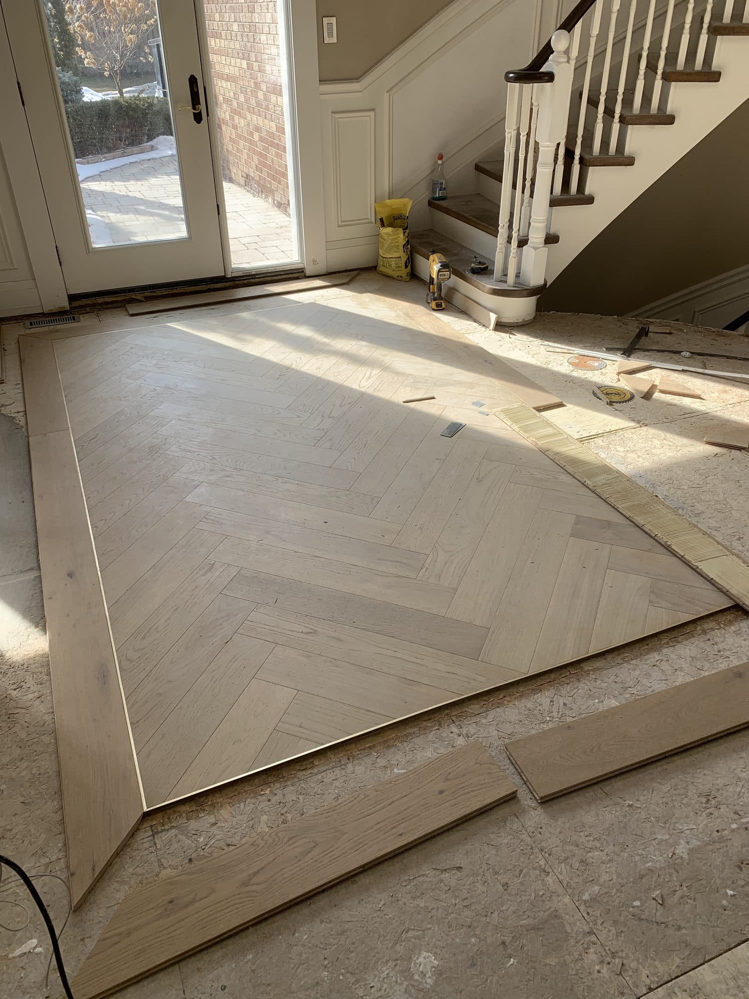 Herringbone hardwood flooring installed by Woodstellar