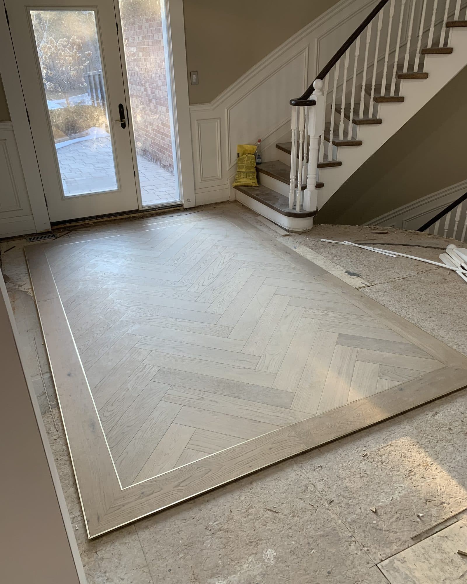 Herringbone hardwood flooring installed by Woodstellar