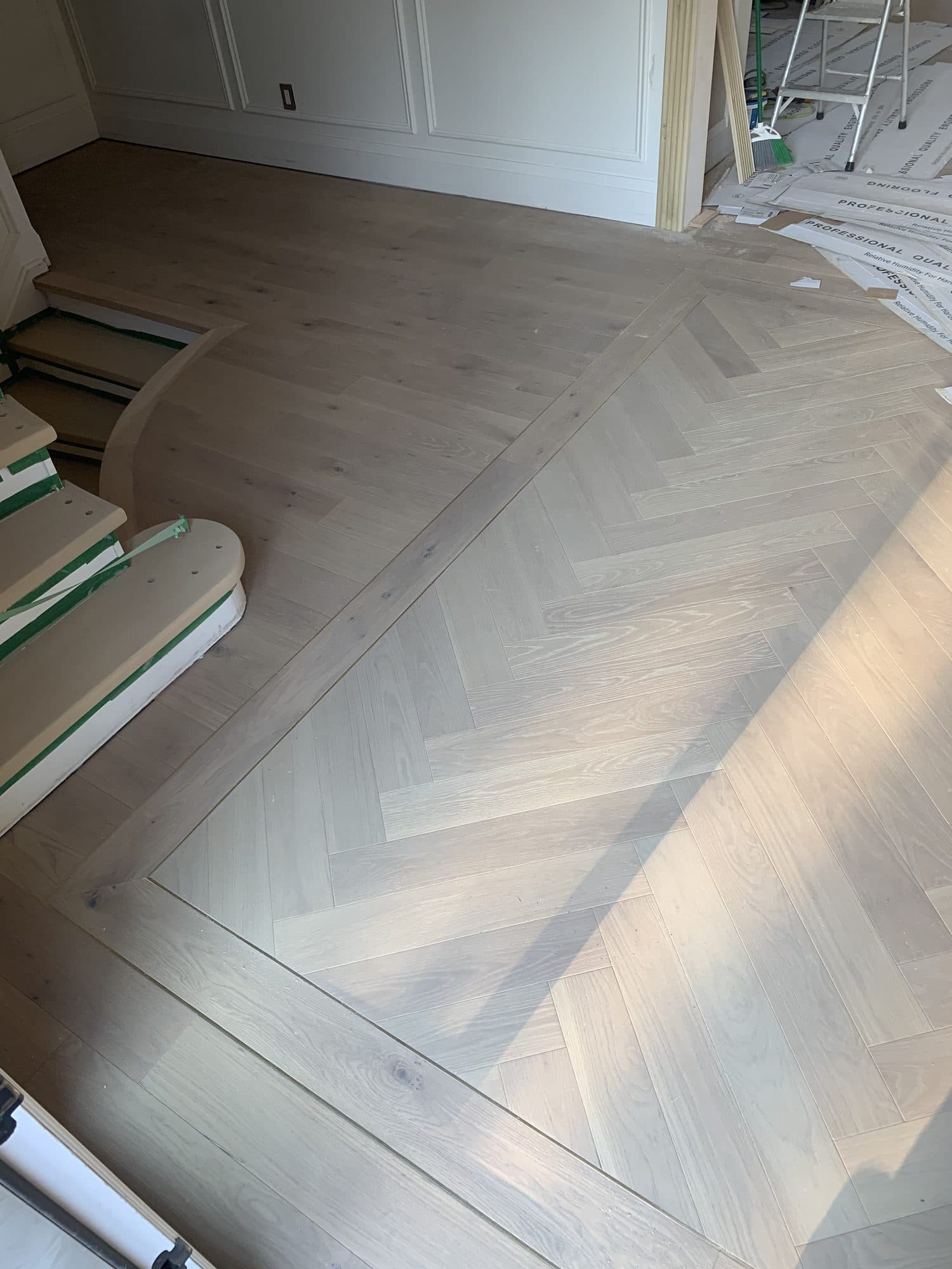 Herringbone hardwood flooring installed by Woodstellar