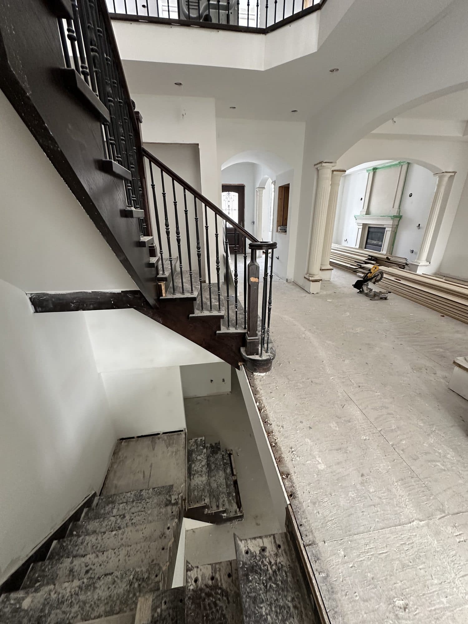 A coffered ceiling and staircase during construction
