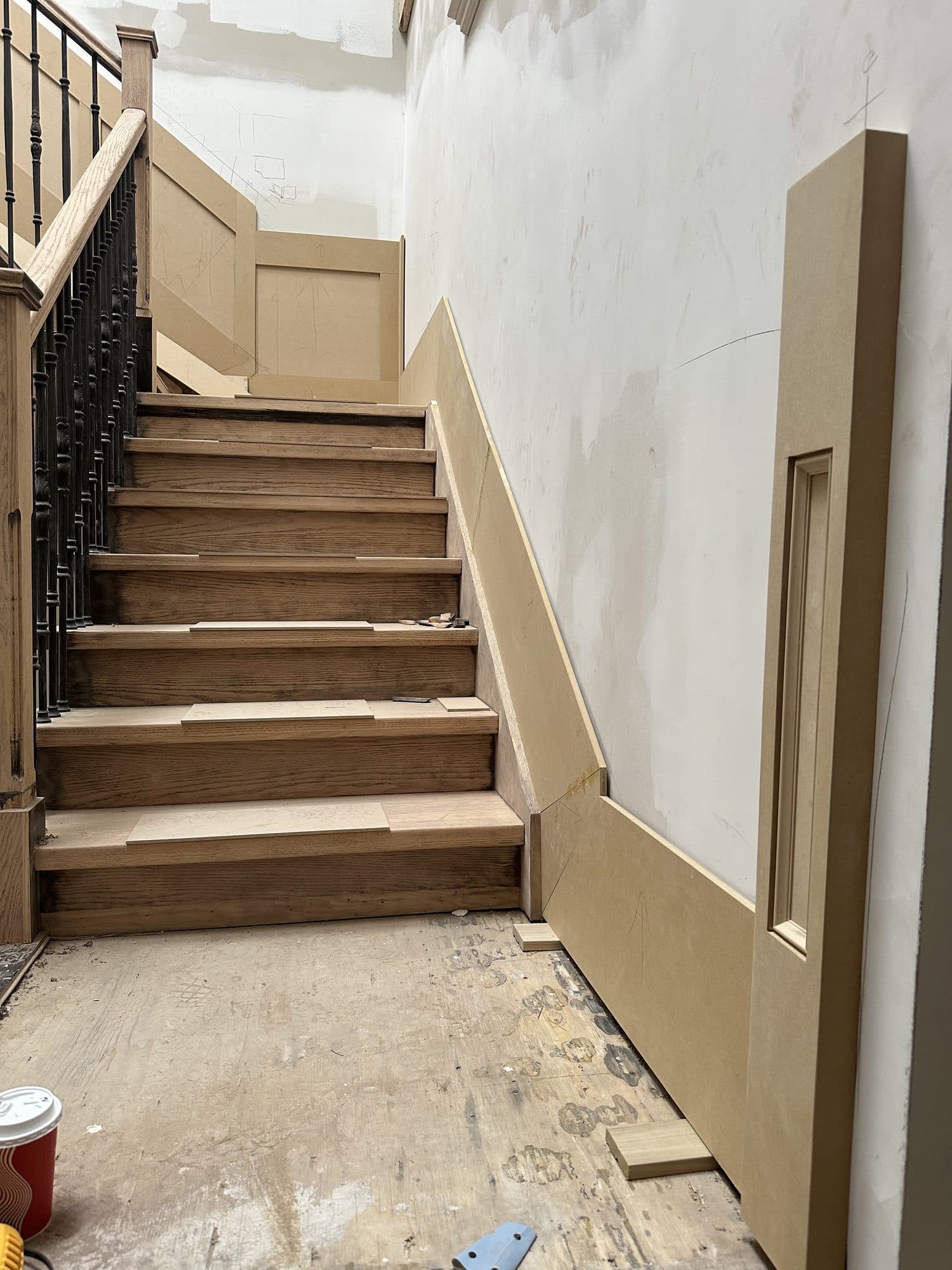 Oak stair treads being fitted during construction