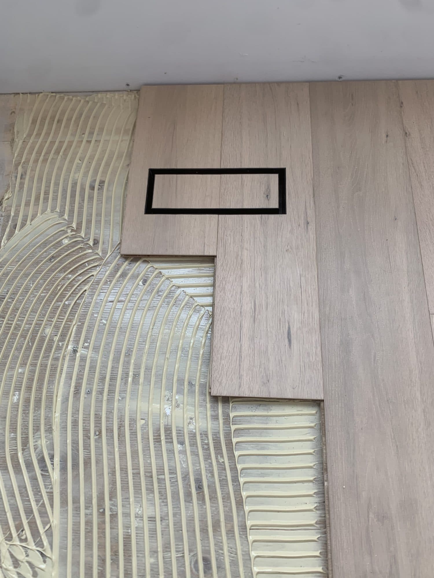 A seamless custom hardwood floor vent by Woodstellar