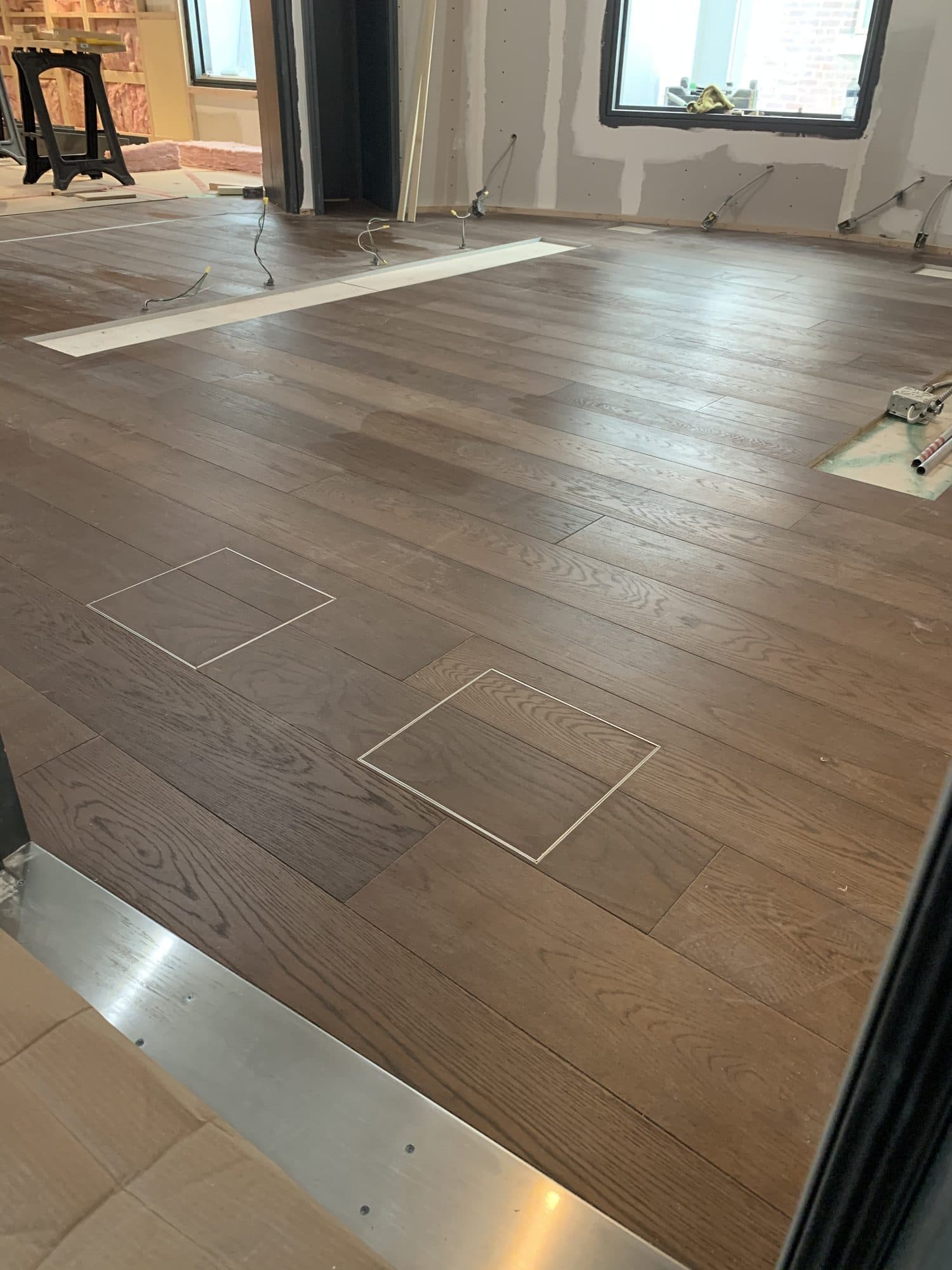 A seamless custom hardwood floor vent by Woodstellar