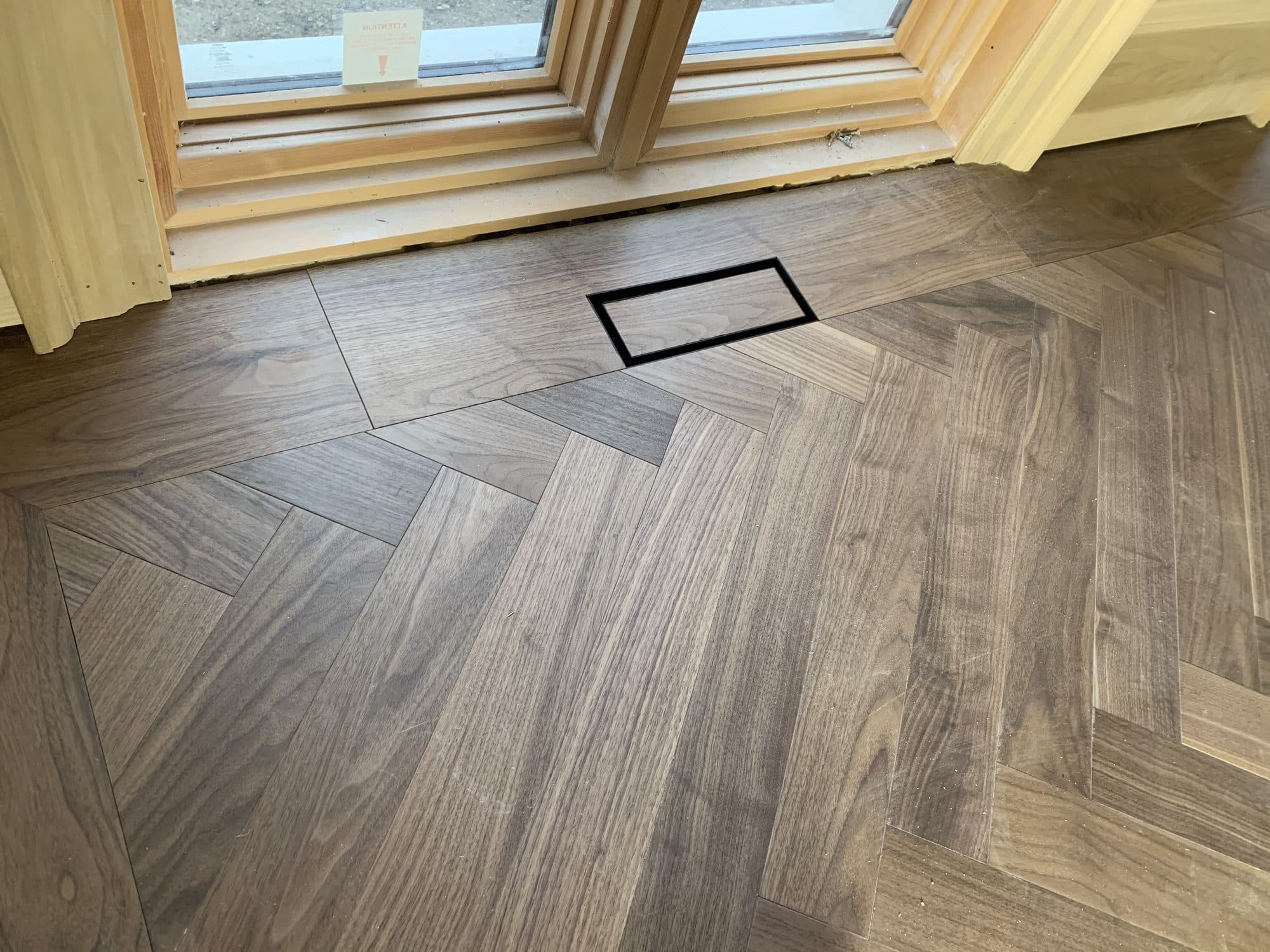A seamless custom hardwood floor vent by Woodstellar