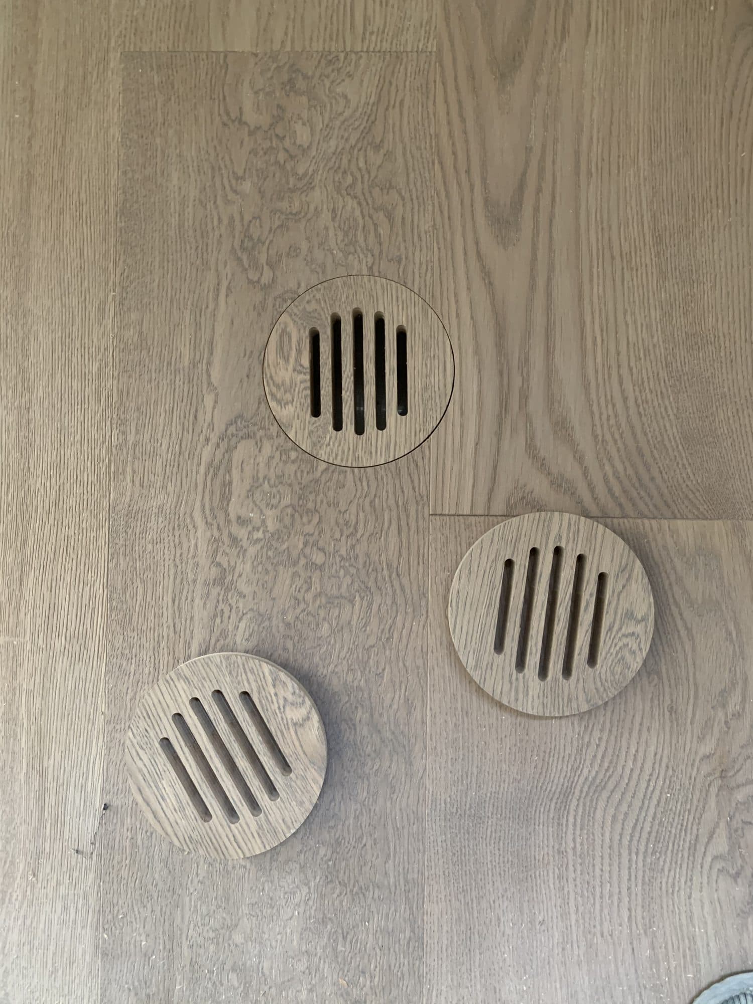 A seamless custom hardwood floor vent by Woodstellar