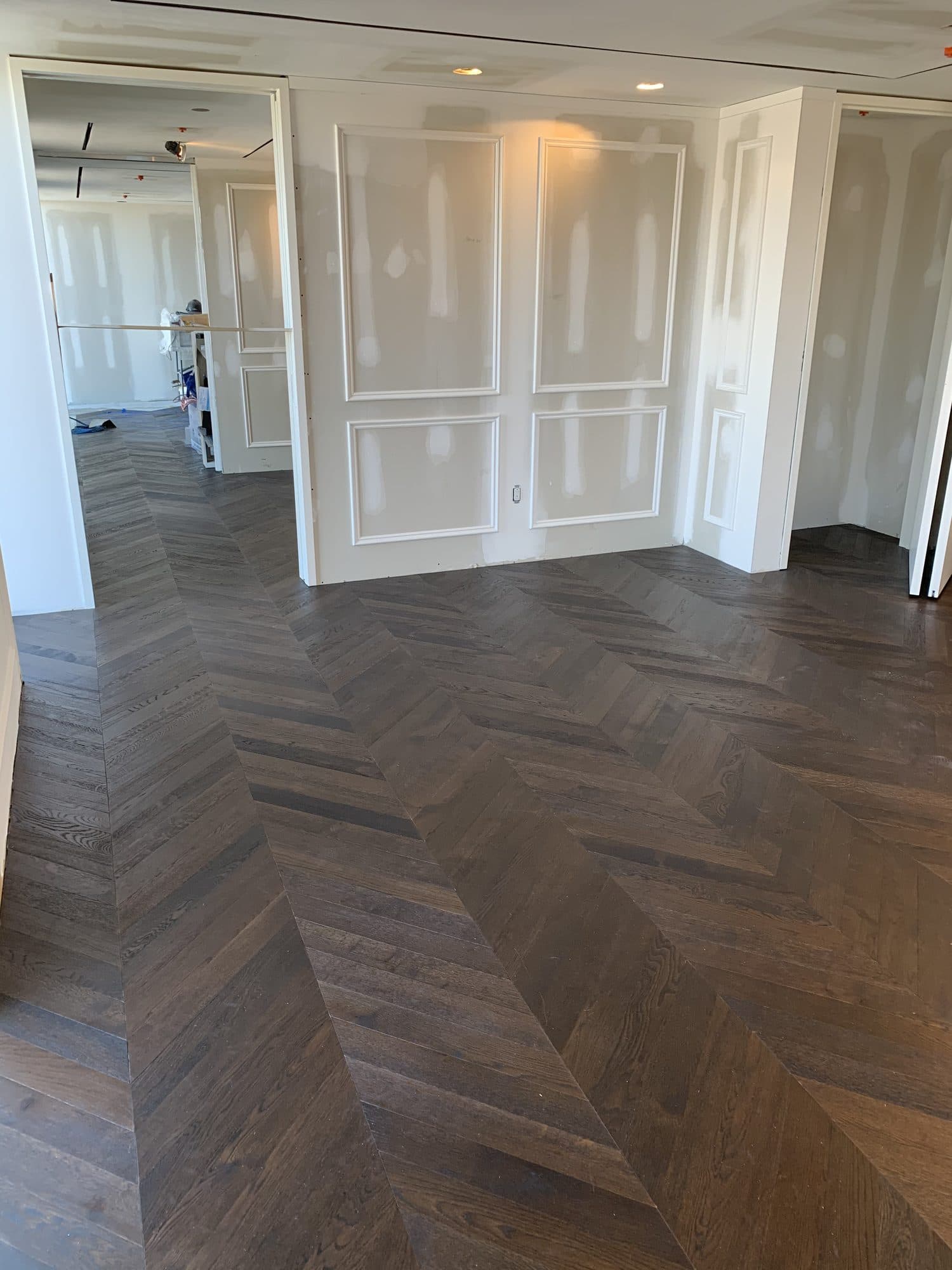 Chevron hardwood flooring installed by Woodstellar